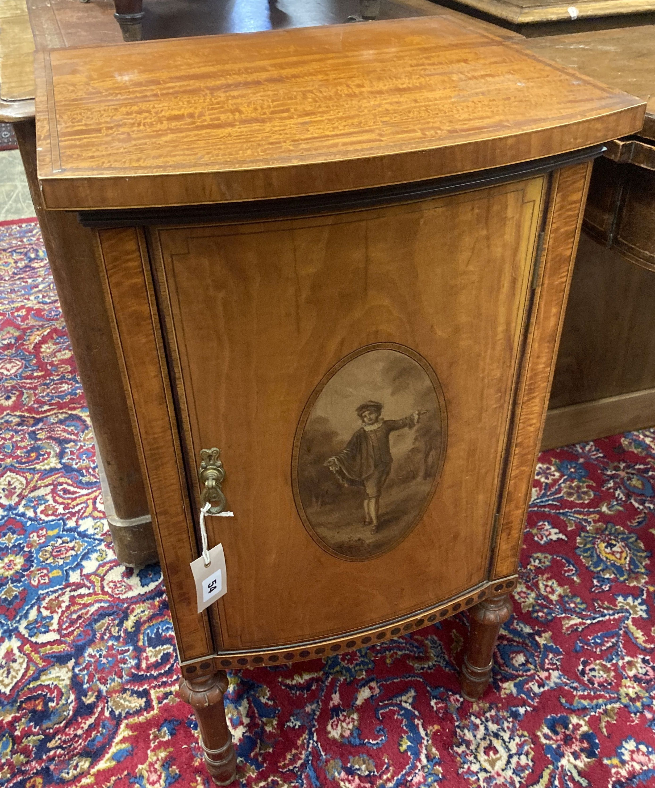 An Edwardian Sheraton revival painted satinwood bow front bedside cabinet, width 44cm, depth 39cm, height 78cm